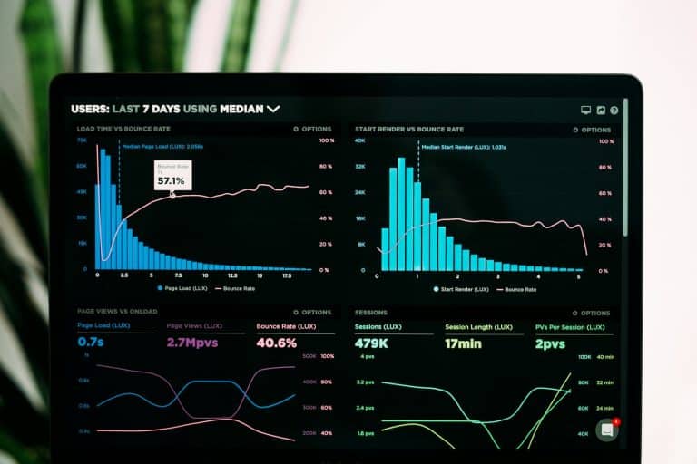 Engineer reviewing AI agent build and run cost estimates on a dashboard